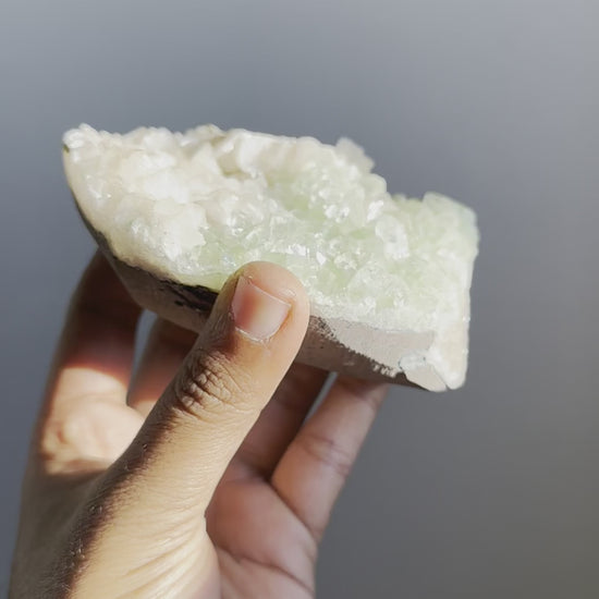 A polished shiny green apophyllite with stilbite mineral video